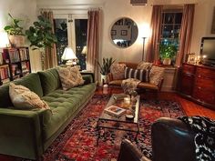 a living room filled with furniture and lots of windows