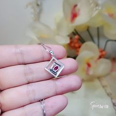 "Tiny square Red Ruby Gemstone Jewelry High Quality unique Artisan design full sterling silver made ◆◆Pendant Main stone:4*6mm created red ruby Pendant Height ( include bail) :22.5mm Pendant Holder (bezel & Bail) : 925 Sterling Silver Accent Stone: Sim Diamond ◆◆ Necklace chain : Platinum gold coated 925 sterling silver Box Chain with length option from 16\" ~20\". The model wearing the default size 18\". 16 inch ≈ 40cm 18 inch ≈ 45cm 20 inch ≈ 50cm ♥ Gemstone Reference Meaning Card included Gemstone Reference, Fire Opal Necklace, Ruby Pendant, Ruby Necklace, Ruby Stone, Ruby Jewelry, Silver Box, Artisan Design, Ruby Gemstone