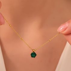 "Emerald Birthstone Jewelry which we offer as 925 Sterling Silver or 14K Solid Gold is the perfect gift for mothers day. The gold Birthstone pendant for mom 14K solid version also comes with a 14K solid gold chain. This gold handmade jewelry silver or gold has the perfect quality.  PRODUCT HIGHLIGHTS  Our birthstone necklace for women is crafted from high quality 925 Sterling Silver or 14K Solid Gold This tiny birthstone gifts can be personalized with your or your loved ones names. Please contact us using Etsy messages for further customization requests. Available in Sterling Silver, Gold and Rose Gold Colors for Sterling silver version. For 14K Solid Gold Version, White Gold, Yellow Gold and Rose Gold is available.  HOW TO ORDER   Please choose your necklace material and color from the dr Emerald Birthstone Jewelry, Peridot Birthstone, Sapphire Birthstone, Emerald Birthstone, Solid Gold Chains, Gold Colors, Birthstone Gifts, Birthstone Pendant, Etsy Personalized Gifts