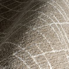 an up close shot of the texture of a bedding with white lines on it