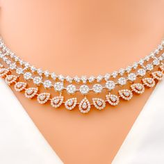 This exquisite 18k gold necklace set, weighing 59.0 grams, features a chic design adorned with dazzling diamonds. The combination of rose and white gold enhances its luxurious appeal, making it perfect for any special occasion. The set includes a necklace with a total diamond weight of 9.97 carats, featuring F-G color and VS quality diamonds in round shapes. The necklace has a length of 17.25 inches with adjustable 0.75-inch links and is secured with a hook lock. The matching earrings, each meas Rose Gold Diamond Necklace, Gold Chic, 18k Gold Necklace, Diamond Necklace Set, Lock Style, Gold Diamond Necklace, Gold Necklace Set, Rose Gold Diamonds, Quality Diamonds