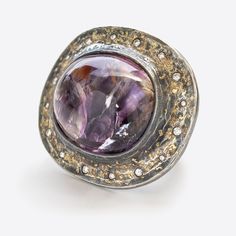 Designed by Michael Endlich Handmade by our workshop Argentium silver ring with natural diamond Gem: bicolor amethyst cabochon, 81.16ct Details: 1 secret round brilliant diamond, 0.19ct Accents: 16 round brilliant diamonds, 0.46ctw Size: 10.25 Scale: approx. 40.7mm x 46.7mm Luxury Round Cabochon Diamond Ring, Luxury Round Cabochon Amethyst Ring, Luxury Amethyst Cabochon Ring For Formal Occasions, Luxury Formal Cabochon Amethyst Ring, Luxury Formal Amethyst Cabochon Ring, Silver Domed Diamond Jewelry, Luxury Silver Dome Ring With Gemstone, Domed Silver Diamond Jewelry, Luxury White Gold Amethyst Ring With Gemstone Accents