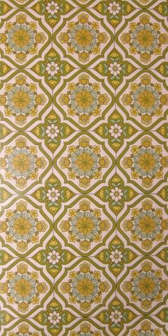 a green and white wallpaper with flowers on it