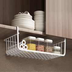 a kitchen shelf filled with dishes and bowls