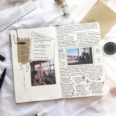 an open book with pictures and writing on it next to some pens, scissors and other items