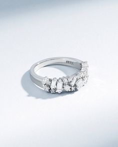 Embrace timeless romance and modern artistry with the La Fantaisie Half Band. This exquisite piece is a symphony of light, featuring an array of baguette and princess-cut white diamonds, each chosen for their radiance and clarity. Details 18k yellow gold, rose gold or white gold 0.97 carats of baguette, princess and round white diamonds 5.5mm width Ref: BAR1054D White Gold Wedding Ring With Rose Cut Baguette Diamonds, Elegant Baguette Diamond Jewelry, White Gold Baguette Cut Rose Cut Diamonds, Diamond White Wedding Rings With Baguette Diamonds, Luxury Moissanite Ring With Rose Cut Diamonds, Fine Jewelry Moissanite Ring With Baguette Diamonds, Timeless Moissanite Wedding Ring With Baguette Diamonds, Baguette Cut Diamond Wedding Ring In Diamond White, Elegant Marquise Cubic Zirconia Wedding Ring