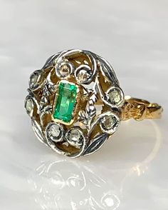 Oval Emerald Ring, Vintage Emerald Ring, Rose cut Diamond Ring, Emerald Gold Ring, Antique Emerald Ring, Emerald Leaf Ring, OOAK Ring A pleasing unusual 18k yellow gold one of a kind piece featuring a 0.80 carat emerald cut Emerald surrounded by rose cut diamonds accented with genuine silver. *Approximate ring weight: 5.65 grams * Ring size: US 8 1/2 Luxury Emerald Ring With Rose Cut Diamonds For Anniversary, Oval Emerald Ring With Rose Cut Diamonds, Fine Jewelry Green Ring With Rose Cut Diamonds, Heirloom Oval Emerald Ring With Single Cut Diamonds, Luxury Emerald Rings With Rose Cut Diamonds, Emerald Cluster Ring With Rose Cut Diamonds For Anniversary, Oval Emerald Ring With Rose Cut Diamonds For Anniversary, Anniversary Oval Emerald Ring With Rose Cut Diamonds, Heirloom Emerald Ring With Rose Cut Diamonds