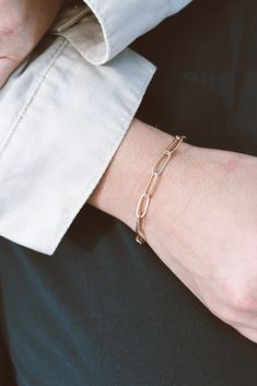 Our Paperclip Collection brings statement pieces into your everyday lineup - even if you're not a statement-jewelry-kinda-person. This beaut is lightweight & breezy while maintaining a bold presence. The Paperclip Bracelet is made from 14k Gold-Filled chain, which means you can live real life in this bracelet without fear of it turning or tarnishing. 14k Gold-Filled 7" length, one size fits most handmade in dallas, tx Hypoallergenic A tip from our team: this bracelet looks stunning paired wi Rose Gold Box Chain Jewelry For Everyday, Everyday Rose Gold Box Chain Jewelry, Elegant Chain Bracelet With Paperclip Chain, Elegant Sterling Silver Paperclip Bracelet With Box Chain, Elegant Metal Paperclip Bracelets, Elegant Sterling Silver Paperclip Bracelet With Adjustable Chain, Elegant Everyday Jewelry With Paperclip Chain, Chic Tarnish-resistant Link Paperclip Bracelet, Timeless Everyday Chain Link Jewelry