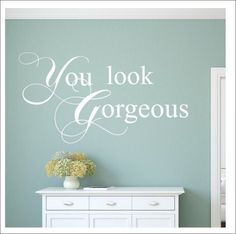 you look gorgeous wall decal in white on a mint green room with dresser and vase