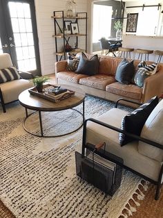 a living room with two couches and a coffee table in the middle is featured on instagram