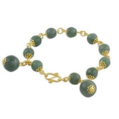 Adorn your wrists with timeless jade! Somluck Komolmith of Thailand handcrafts this beautiful design. Combining 18k gold plated brass with cool gemstone globes her bracelet features jade beads and a hook clasp. Handmade Elegant Aventurine Bracelets, Spiritual Jade Bracelet Jewelry, Elegant Aventurine Bracelet Jewelry, Elegant Aventurine Bracelet, Gold Agate Bangle Bracelet, Gold Jade Bangle Bracelet, Gold Agate Bangle Jewelry, Gold Jade Beaded Bracelets For Spiritual Purposes, Gold Jade Beaded Bracelets For Spiritual Wear