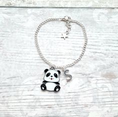 Super cute enamel panda charm bracelet perfect for any sloth lover. Great little gift for kids or a present for mothers day. *The chain measures approximately 7.5inches for adults and for children I will require their age to make the bracelet the correct size... so please make a note when ordering. *The black and white enamel charm measures approximately 2.5cms long. *The charm, chain and other findings are silver plated. *These can also be personalised with initial charms which can be picked from the menu. ☆☆The bracelet comes presented in a gift bag but boxes and gift wrapping can also be purchased from my store.☆☆ If you have any questions or custom orders please feel free to message me. Panda Bracelet, Boyfriend Initials, Panda Necklace, Panda Charm, Bracelet Cute, Animal Bracelet, Sloth Gift, Personalised Jewellery, Charm Chain