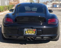 the back end of a black sports car with a license plate that reads aporch