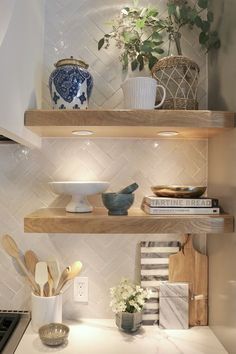 the shelves in the kitchen are filled with cooking utensils and other decorative items