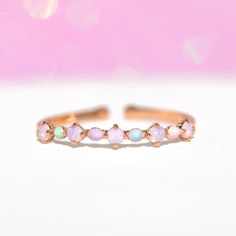 Brightening up your mood (and outfit) will feel effortless with our Pastel Hues Ring! The multicolored pastel stones and enamel accents make this the perfect ring to add a bit of sunshine to your day. Adjustable Pink Opal Ring As A Gift, Adjustable Multicolor Stackable Rings, Trendy Pink Adjustable Enamel Ring, Trendy Adjustable Enamel Promise Ring, Pink Enamel Open Ring For Promise, Adjustable Pink Crystal Birthstone Ring, Adjustable Pink Enamel Open Ring, Adjustable Pink Opal Ring, Adjustable Pink Round Opal Ring