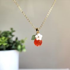 Can't find your perfect fit length? Do have material requirements? We offer custom orange fruit necklace. Your satisfaction is our priority. How to customize? You choose the design; we hand make the necklace for you. Elevate your style with this exquisite orange flower pendant necklace. The pendant is delicately crafted with intricate details, capturing the beauty of nature in its design. You offer various colors of orange. Lightweight and comfortable to wear, it's the perfect accessory to compl Peach Necklace Gift, Peach Round Necklace Gift, Peach Round Necklace For Gift, Round Peach Necklace For Gift, Gift Round Peach Necklace, Orange Pendant Charm Necklaces For Gifts, Orange Round Pendant Jewelry As Gift, Orange Round Pendant Jewelry For Gift, Orange Round Pendant Jewelry Gift