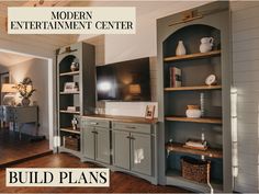 an entertainment center with built - in cabinets and shelves is featured for the model apartment center