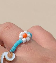 beaded daisy rings available in white and blue fits up to sizes 7-10 Daisy Rings, Beaded Daisy, Daisy Ring, Butterfly Ring, Midi Rings, Blue Fits, Ring Photos, Heart Of Gold, Turquoise Bracelet