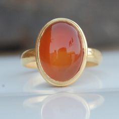 Natural Carnelian 925 Sterling Silver Ring, 18K Rose Gold, 18K Yellow Gold Oval Cab Orange Carnelian Ring, Statement Zodiac Jewelry Gemstone : Carnelian Stone Size : 14 x 10 mm Ring Size : Please Choose Your Size stone Color : Carnelian Material : Please choose your metal It's a unique gift for anyone zodiac style ring . Please Notice before checkout :- Due to we use natural stones, the stones may vary slightly in shape, size and color. Contact us for any other gemstone customization before chec Yellow Gold Oval Cabochon Carnelian Rings, Carnelian Yellow Gold Rings With Oval Cabochon, Yellow Gold Carnelian Oval Cabochon Ring, Heirloom Carnelian Oval Rings, Classic Carnelian Cabochon Rings, Oval Carnelian Moonstone Ring For Anniversary, Heirloom Carnelian Yellow Gold Rings, Carnelian Gold Wedding Rings, Gold Carnelian Ring For Wedding