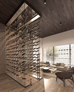 a living room filled with furniture and a wine rack