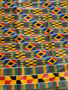 This kente African Fabric is high quality African print made from 100% cotton and it's 45 inches wide. It is used for making African Clothing, African quilts, & For Home decoration. FYI: Print is Double sided. The listing is for 1, 6 yards and Headwrap Each piece of fabric measures: 36in by 45in for 1 yard 216in by 45in for 6 yards 70in by 22in for Head wrap If you purchase more than one yard, you will receive one continuous piece. *If you require more than what I have listed, feel free to s Traditional Yellow Fabric With Colorful Pattern, Yellow Fabric With Traditional Patterns For Festivals, Yellow Ankara Fabric With Traditional Patterns, Yellow Ankara, African Quilts, African Prints, Ankara Fabric, Wax Print, African Fabric