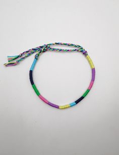 Pastel friendship bracelet, Wrapped bracelet, Pastel goth, Pastel grunge This colourful wrapped bracelet is made out of turquoise,navy,green,pink,purple and lemon cotton thread. It is ended with two braids in order to fit a lot of sizes. Custom orders for different color combinations are welcome. Width:0,4cm Other friendship bracelets in my shop: https://www.etsy.com/shop/LuckyRatJewellery?section_id=16489590&ref=shopsection_leftnav_7 *Colors may differ slightly from the original due to the conf Handmade Beaded Bracelet For Friendship, Hippie Style Adjustable Cord Bracelets For Friendship, Hippie Style Bracelets With Adjustable Cord For Friendship, Hippie Style Friendship Bracelet With Adjustable Cord, Adjustable Cord Hippie Bracelets For Friendship, Multicolor Wrap Bracelet With Sliding Knot For Gift, Multicolor Wrap Bracelet With Sliding Knot As Gift, Multicolor Wrap Bracelet With Sliding Knot, Casual Handmade Friendship Bracelets For Best Friend