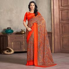 Orange colored saree is made from chiffon fabric which is highlighted with beautiful printed work as shown. Comes along with unstitched chiffon blouse piece which you can customise as per your design/style. Occasion - You can wear this saree for casual and daily wear. Note:- the actual product may differ slightly in color and design from the one illustrated in the images when compared with computer or mobile screen. Measurements: Saree : Chiffon : 5.5 Mtrs Blouse : Chiffon : 0.8 Mtr Material: Chiffon Stitch Type: Unstitched Country of Origin: India Care Guide: Dry Clean Elegant Orange Semi-stitched Saree, Traditional Semi-stitched Chiffon Saree, Orange Unstitched Saree With Motifs, Orange Chiffon Saree, Printed Chiffon Saree, Semi-stitched Multicolor Chiffon Saree, Saree Chiffon, Blouse Chiffon, Mobile Screen