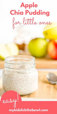 apple chia pudding for little ones in a jar with spoons and apples behind it