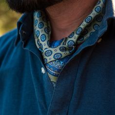 This neckerchief can effortlessly shift your style, whether you're going for a timelessly classic look or something a bit more rakish.The rich medallion pattern in blue with a touch of lavender on a light green background takes inspiration from the charm of Tuscany’s cobblestone streets.Crafted from luxurious silk twill—a must-have accessory for any man who appreciates refined elegance. Details The classic neckerchief size: Approx. 27" x 27" (70 x 70cm). A comfortably large size that fits most m Elegant Green Scarf For Formal Occasions, Classic Scarf Neckwear As Gift, Classic Silk Scarf For Spring, Classic Green Neckwear For Gift, Elegant Fitted Green Neckwear, Classic Silk Scarf, Men Neckerchief, Neckerchief Men, Mens Neckerchief