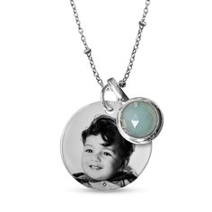 Keep that special someone or a special memory close to your heart when you wear this personalized and engravable photo and birthstone charm pendant. Created in sterling silver The round disc features the photo of your choice - expertly transferred using modern technology, and is scratch resistant, 100% waterproof and available in high resolution color or black and white. A charm glistens beside with the 7.75mm bezel-set birthstone you select. Complete this customized design with up to two lines Silver Charm Necklace With Engraving Option For Anniversary, Silver Charm Necklace For May Birthstone, Personalized White Gold Pendant Birthstone Necklace, Classic Sterling Silver Charm Necklaces With Birthstone, Silver Birthstone Necklace For Personalized Gift, Personalized Jewelry For Memorial, Silver Birthstone Necklace With Charms For Anniversary, Silver Round Disc Birthstone Jewelry, Silver Birthstone Round Disc Jewelry