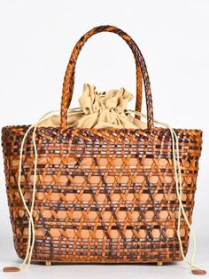 Casual style. Lightweight. Straw. Raffia natural fiber. Lined. Drawstring. Metal bottom accesories. Measurements are 24 cms. Length (9.44” inches) x 20cms height (7.87” inches) x 12 cms width (5" inches) Color may be lighter or darker depending of the device it is displayed. Light Brown Woven Vacation Bag, Light Brown Woven Bags For Vacation, Woven Light Brown Bags For Vacation, Woven Light Brown Vacation Bags, Chic Light Brown Beach Bag, Rectangular Light Brown Bucket Bag For Beach, Casual Light Brown Woven Straw Bag, Spring Brown Handwoven Shoulder Bag, Chic Light Brown Bucket Bag For Beach