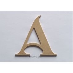 a wooden cut out of the shape of a triangle with an arrow on it's side