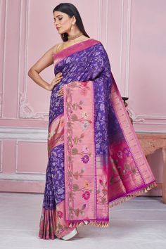 Radiate elegance on special occasions in this beautiful purple Banarasi saree with pink zari minakari border. It comes with a blouse piece. Disclaimer: The shown stitched blouse on the model is for display purpose only. The saree comes with a matching blouse piece and finished with fall and piko. Fashion Journals, Tussar Silk Saree, Traditional Fabric, Banarasi Sarees, Pure Silk Sarees, Sarees Online, Blouse Piece, Blouse Dress, Fashion Store