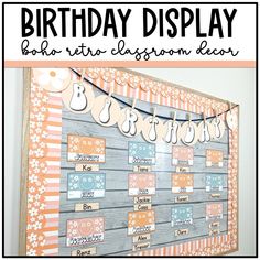 a birthday display board with the words happy birthday displayed on it and an orange flowered banner