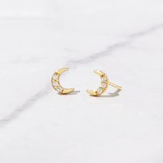 Tiny moon stud earrings! Perfect for a minimalist or for stacking! - - - D E T A I L S - - - * Made of 925 Sterling Silver * We use a THICK, DURABLE plating of 14K Gold, Rose Gold or Rhodium - for a piece that will last you years to come! * Highest Grade CZ for an authentic diamond look! * Nickel-free & Hypoallergenic * Length: 5.4mm ♥︎ ♥︎ ♥︎ Model Details ♥︎ ♥︎ ♥︎ 2nd Hole- https://www.etsy.com/listing/1154500077/tiny-ball-stud-earrings-ball-studs-stud?click_key=772e6d7f7021c5b7e72d2c2498531b61 Dainty Crescent Earrings For Everyday, Crescent Shaped Pierced Earrings For Gifts, Elegant Hypoallergenic Moon Shaped Earrings, Round Earrings With Moon Charm For Anniversary, Crescent Earrings For Anniversary, Moon Shaped Cartilage Earring As Gift, Moon Shaped Single Cartilage Earring As Gift, Celestial Crescent Earrings For Everyday, Everyday Celestial Round Earrings