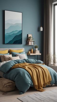 a bed with blue and yellow comforters in a bedroom