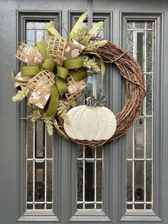 a wreath is hanging on the front door