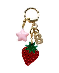 You've likely seen this viral bag charms content all over the internet -- as well as in ELLE, Who What Wear & The Wall Street Journal to name a few. We're excited to introduce this limited-edition STRAWBERRY GIRL KEYCHAIN that is so darling that you will want to attach to all of your precious belongings. Featuring a cutesy strawberry charm and a bubbly pink star charm. Your choice to add a Blingy Bauble initial to level up! So perfect as a personalized gift. Find the other charm options here. A Pink Girly Gifts, Trendy Accessories 2024, Backpack Keychains Aesthetic, Cute Car Keys Keychains Ideas, Cheap Christmas Gifts For Friends, Key Chains Aesthetic, Car Keys Keychain Ideas, Cute Bag Charms, Y2k Gifts