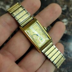 Get ready to be stunned! This is a simply stunning Vintage Art Deco Style 14k Buren Grand Prix automatic 17 jewels unisex adult wristwatch w/ a Swiss unadjusted movement, silver inlay on the watch face, solid 14k yellow-gold case & gold toned Speidel metal bracelet band. Watch is working, and keeps time pretty well, although not perfectly! The watch will need to be cleaned & serviced after purchase to ensure it is restored to it's former glory. The case has been verified as solid 14k, and the mo Metal Bracelet, Vintage Band, Gold Case, Metal Bracelets, Deco Style, Vintage Art Deco, Grand Prix, Art Deco Fashion, Jewellery And Watches