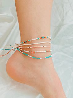 These beachy boho anklets are so dainty and would make a nice gift. They are great for everyday wear! Stack these together, with other anklets, or wear them by themselves! Choose which anklet you like best from the 8 options I have here! This listing is for a single anklet. ∙ ∙ ∙ ∙ ∙ ∙ ∙ ∙ ∙ ∙ ∙ ∙ ◆ MATERIALS ◆ * High-Quality Seed Beads of Various Colors * Waxed Linhastia Polyester Cord Please allow slight variation in color from photos. I do my best to take photos that are true to color. ∙ ∙ ∙ White Ankle Wrap Anklets For Beach, Adjustable White Anklets For Beach Season, Dainty Adjustable Anklets With Colorful Beads, Adjustable Dainty Anklets With Colorful Beads, Dainty Summer Beach Anklets, Dainty Anklets For Beach In Summer, Dainty Anklets For Beach And Summer, Adjustable Beaded Beachy Anklets, Dainty Handmade Adjustable Anklets