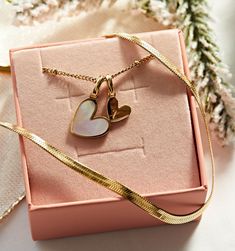 Set of 2 - Our meaningful Heart Necklace With Mother of Pearl alongside our Herringbone Chain Necklace. This darling set is dainty enough to wear as your everyday stack or dress up with other favorites. A perfect gift to give new moms, your partner, or your best friend. Engravable with your choice of initial for that personal touch every gift needs.
Herringbone chain length: 18" , 4mmHeart disks: 9mm, 15mm | Adjustable chain: 17"-19" Herringbone Chain, Snake Chain Necklace, Skin Allergies, Pinky Promise, Zodiac Necklaces, Gold Piece, Flower Bracelet, Everyday Jewelry, Huggies Earrings