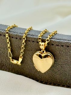 14k Gold Heart locket Necklace, 22", 2.5mm. 14k Gold Heart locket Necklace, 20", 2.5mm. Priced to sell! Compare our prices to other similar sellers! Arrives in a GIFT BOX and includes FREE SHIPPING within the USA and Canada. International shipping is available at the most economical rates on ETSY. I HAVE BEEN IN THE JEWELRY BUSINESS ALL MY LIFE. I am a second -generation family member making gold and jewelry. Please feel free to ask me any questions - Always happy to help! Fast Replies to messag Rose Gold Locket Necklace With Charms For Gift, Gold Heart Pendant Locket Necklace With Hallmark, Gold Locket Necklace With Hallmark For Mother's Day, Gold Locket Necklace For Mother's Day With Hallmark, Gold Locket Necklace For Mother's Day, Gold Heart Pendant Locket Necklace Stamped 14k, 14k Gold Pendant Locket Necklace For Gift, 14k Gold Round Pendant Locket Necklace For Gift, Gold Charms Locket Necklace Keepsake