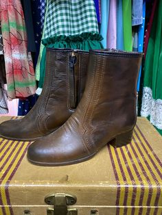 There's nothing like vintage leather boots! These size 6 brown leather boots are in amazing shape, almost as if they've never been worn! They measure 9 1/2 inches heel to toe, 7 1/2 inches from the top of the boot to the base and 3 inches across in the toe(wide). These boots are American made, leather and have a fleece lining on the inside! They even have a vintage tag inside! These come up a little less than mid calf; slightly longer than an ankle boot. These would be amazing with a dress or vi Retro Ankle-high Boots For Fall, Retro High Ankle Boots For Fall, Vintage Heeled Boots With Pointed Toe And Leather Sole, Retro Leather Mid-calf Boots With Round Toe, Retro Mid-calf Leather Boots With Round Toe, Retro Moto Boots With Round Toe For Fall, Vintage Fitted Heeled Boots With Leather Sole, Retro Ankle Boots For Winter, Retro Ankle Boots For Fall