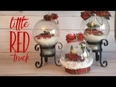 three snow globes with christmas decorations in them and the words little red truck inside