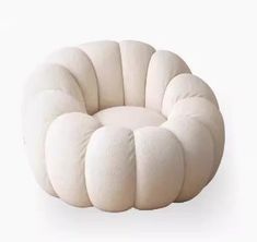 a white chair that is shaped like a flower with four petals on the front and back