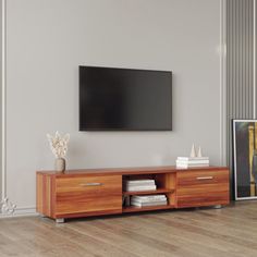 a flat screen tv mounted to the side of a wooden cabinet in a living room