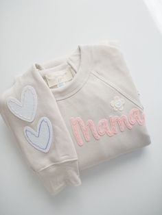 a white shirt with the word mama on it