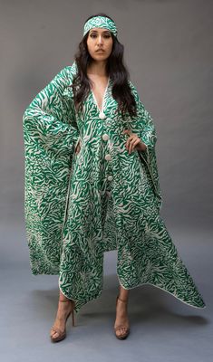 This lightweight kaftan dress  is perfect for lounging by a poolside or just to  throw on to wear all day. Flowy Maxi-length Abaya For Eid, Green Bohemian Maxi Length Sets, Long Sleeve Abaya For Beach And Eid, Long Sleeve Abaya For Beach Eid, Long Sleeve Abaya For Eid Beach Occasion, Elegant Long Sleeve Green Tunic, Long Kimono For Beach Eid Festival, Bohemian Green V-neck Abaya, Traditional Green Dress With Kimono Sleeves