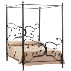 a metal bed frame with an iron headboard and foot board