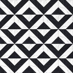 a black and white tile pattern with triangles